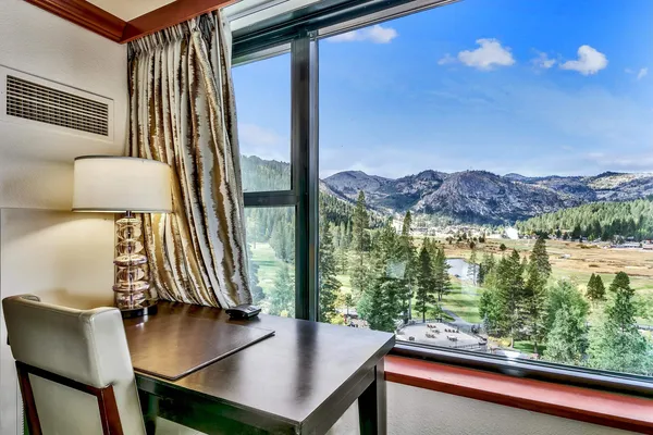 a view of living room with furniture and floor to ceiling window