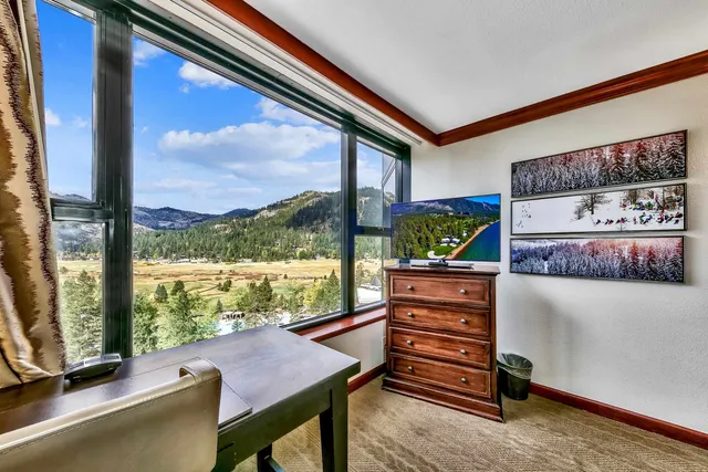 a room with furniture and a window