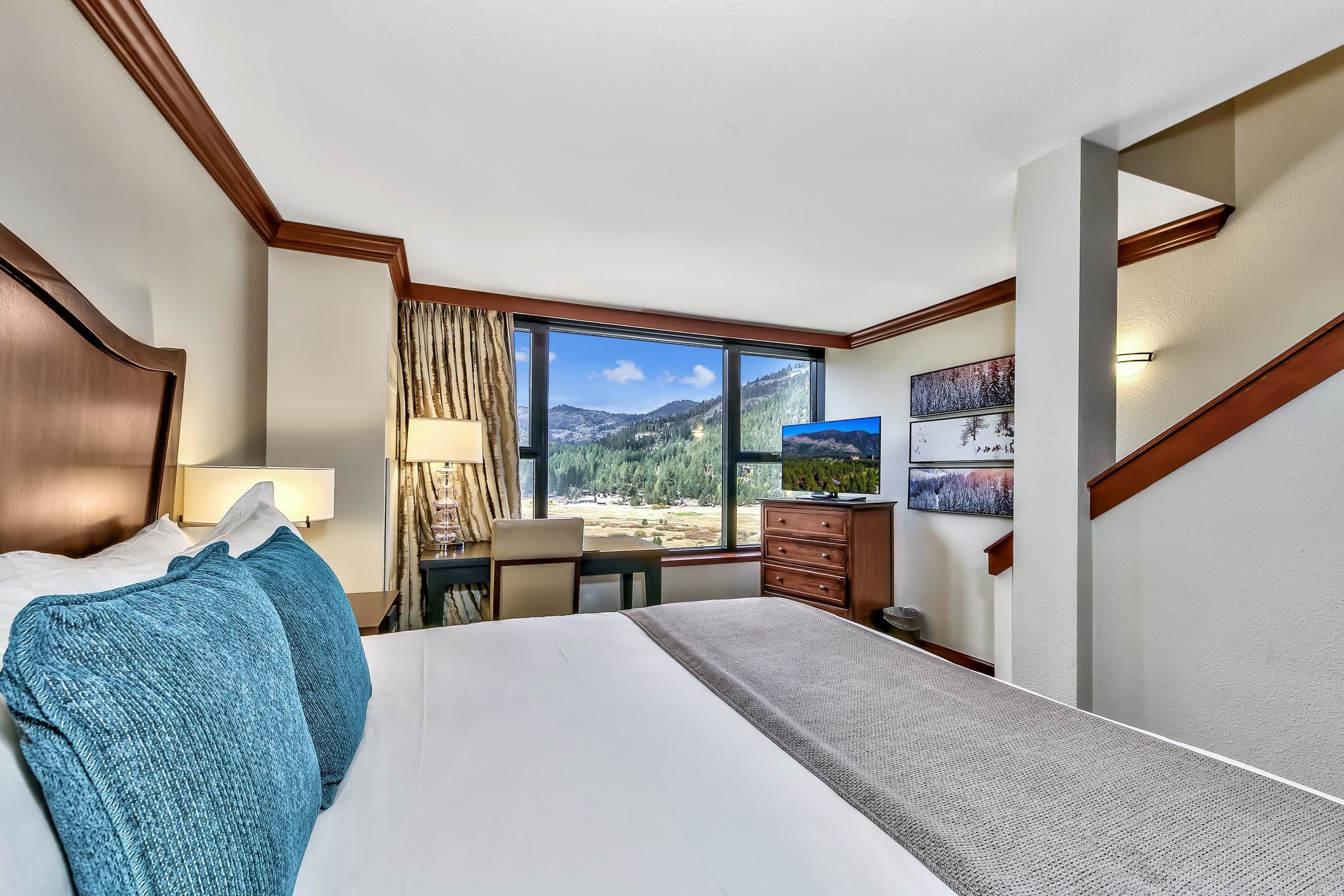 400 Resort Road, Unit 958 Olympic Valley, CA 96146 - Photo 5 of 21 a bedroom with a large bed and a large window