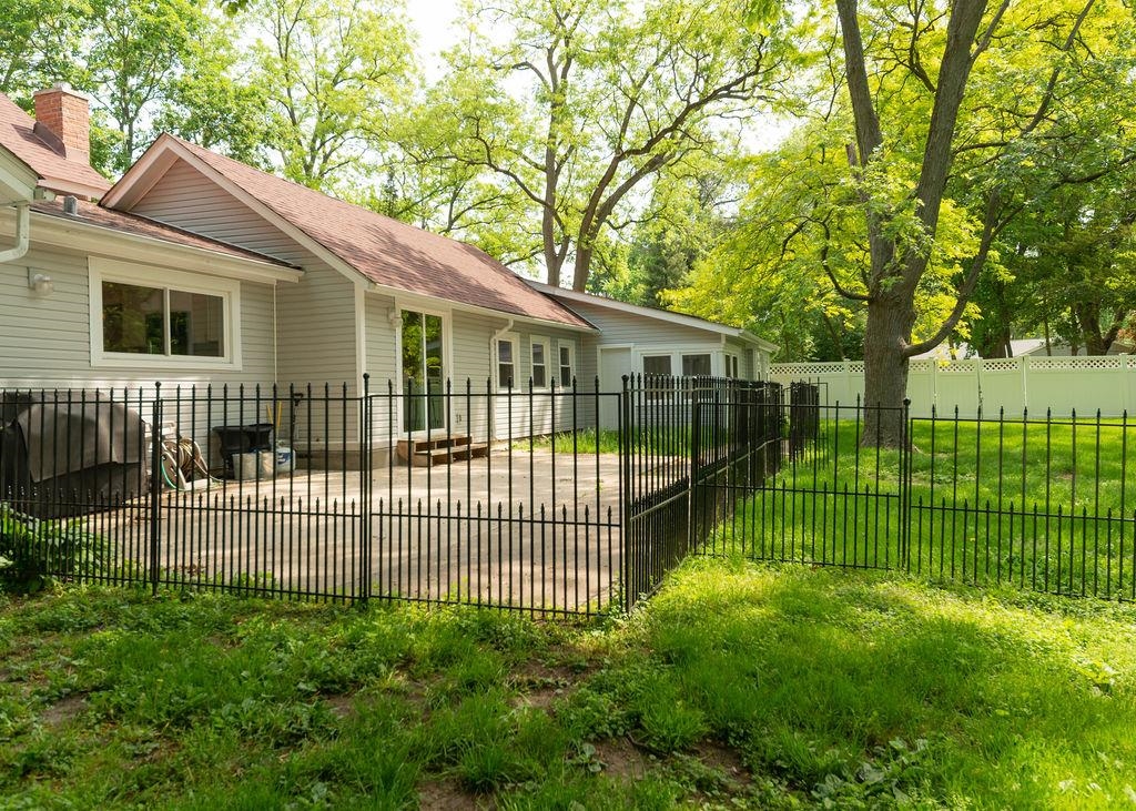 3711 Highcrest Road Rockford, IL 61107 - Photo 13 of 58 a view of a backyard with a small garden
