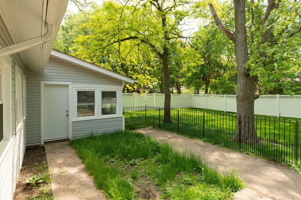 3711 Highcrest Road Rockford, IL 61107 - Photo 19 of 58 a view of a backyard with a garden