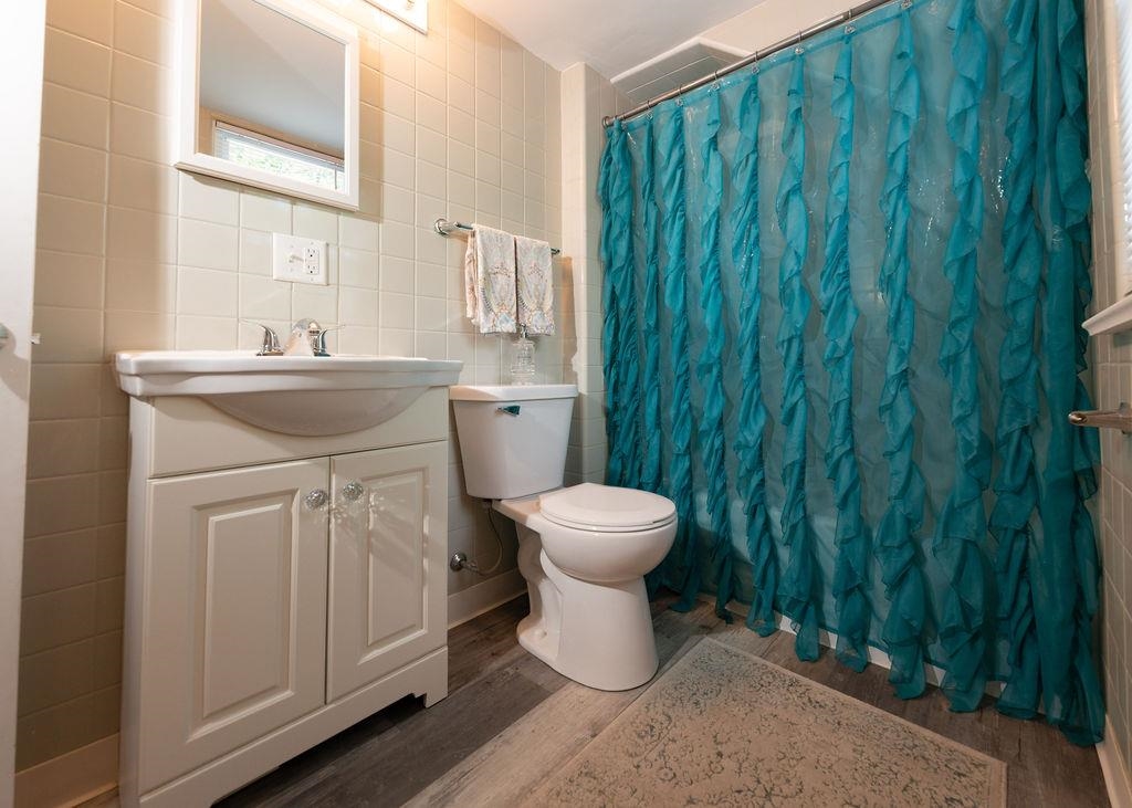 3711 Highcrest Road Rockford, IL 61107 - Photo 55 of 58 a bathroom with a toilet sink and vanity