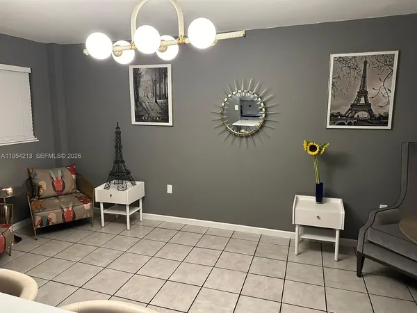 a bathroom with a sink mirror and window