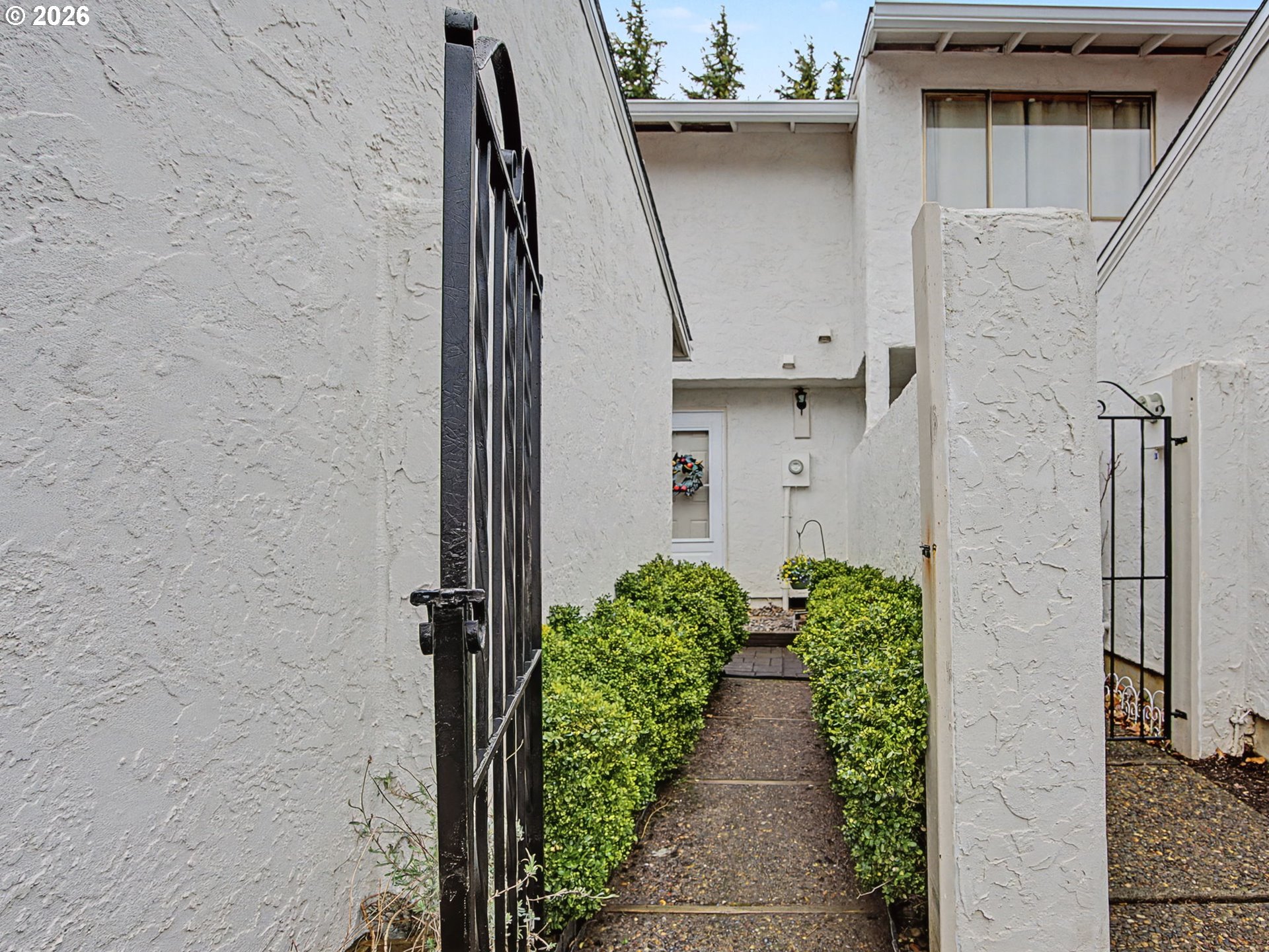 3214 Northeast 29th Street Gresham, OR 97030 - Photo 1 of 42 a view of a pathway of a building