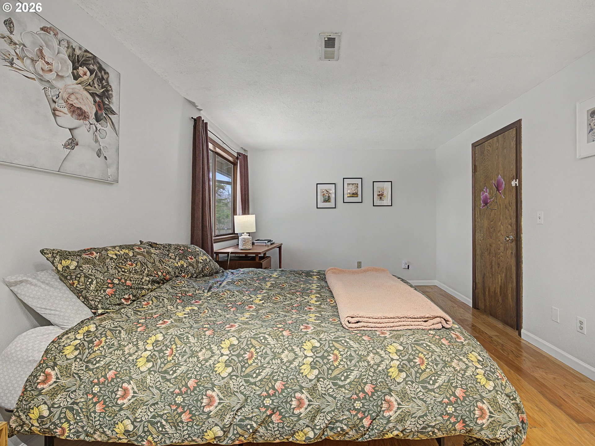 3214 Northeast 29th Street Gresham, OR 97030 - Photo 16 of 42 a bedroom with a large bed and a window