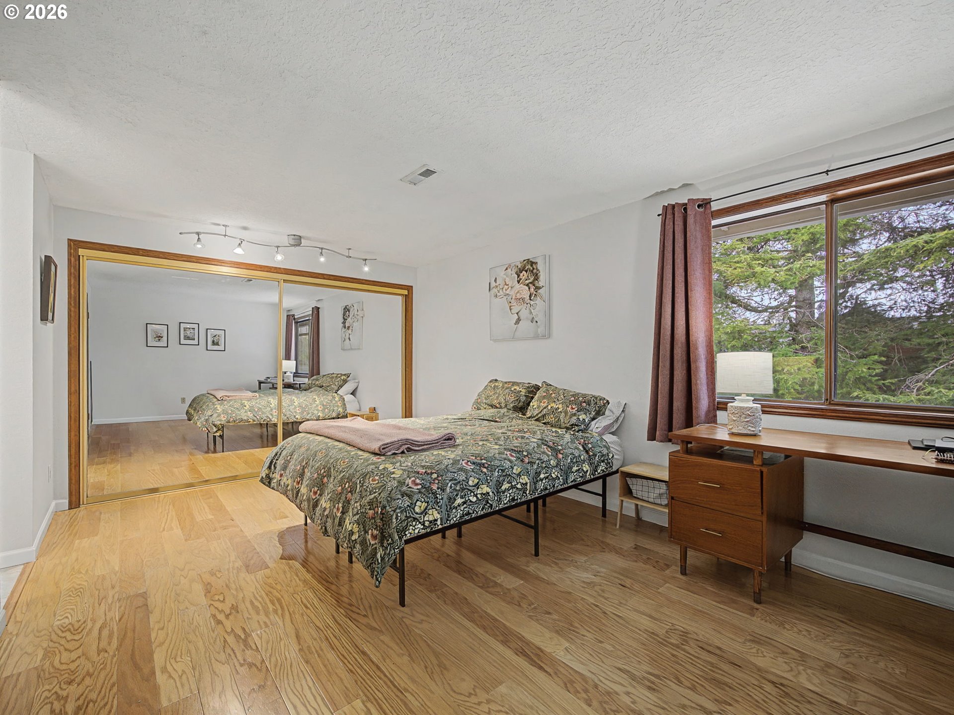 3214 Northeast 29th Street Gresham, OR 97030 - Photo 17 of 42 a bed room with a bed and a large window
