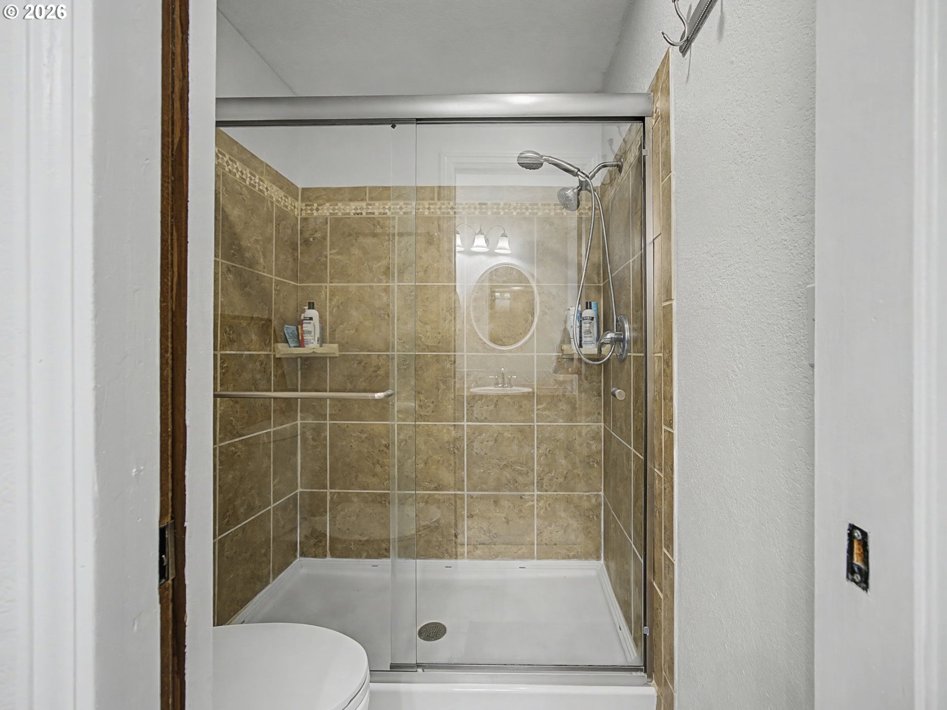 3214 Northeast 29th Street Gresham, OR 97030 - Photo 20 of 42 a bathroom with a shower and a sink