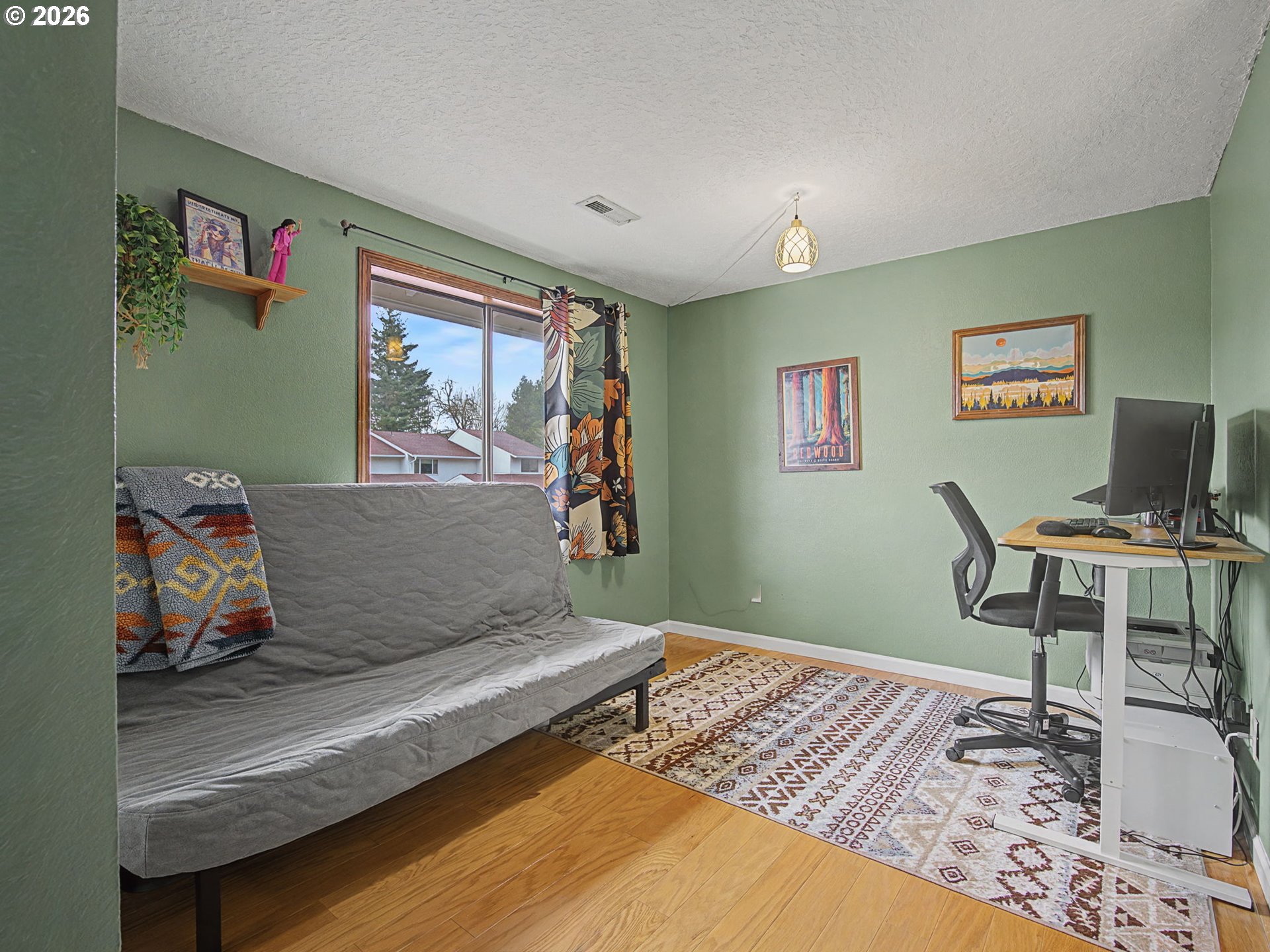 3214 Northeast 29th Street Gresham, OR 97030 - Photo 21 of 42 a living room with furniture and a wooden floor