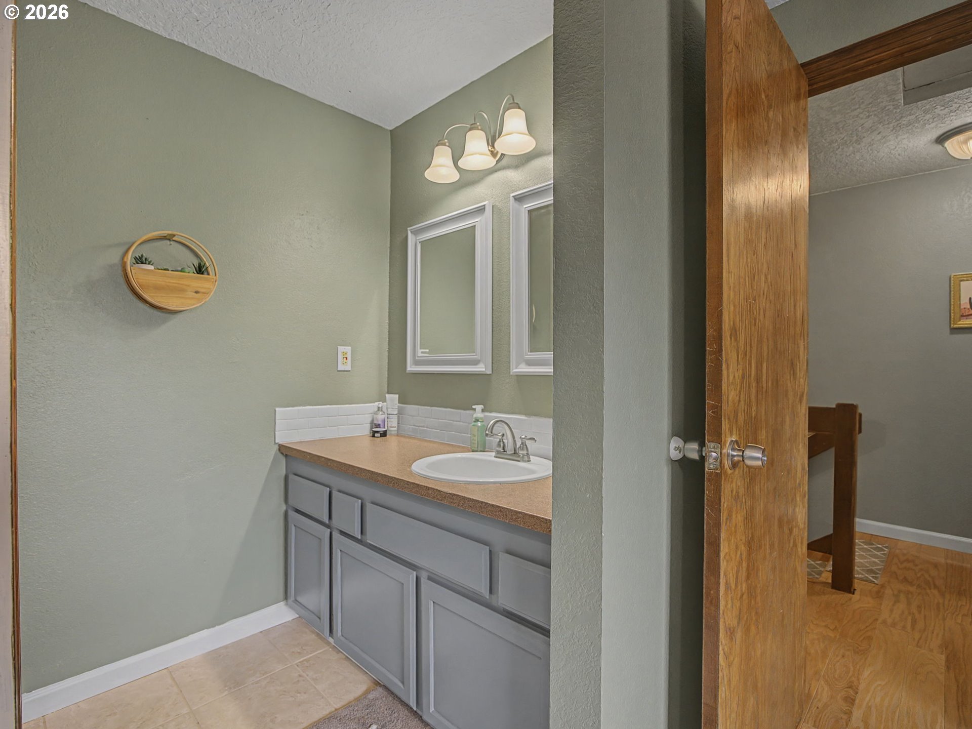 3214 Northeast 29th Street Gresham, OR 97030 - Photo 24 of 42 a bathroom with a sink and a mirror
