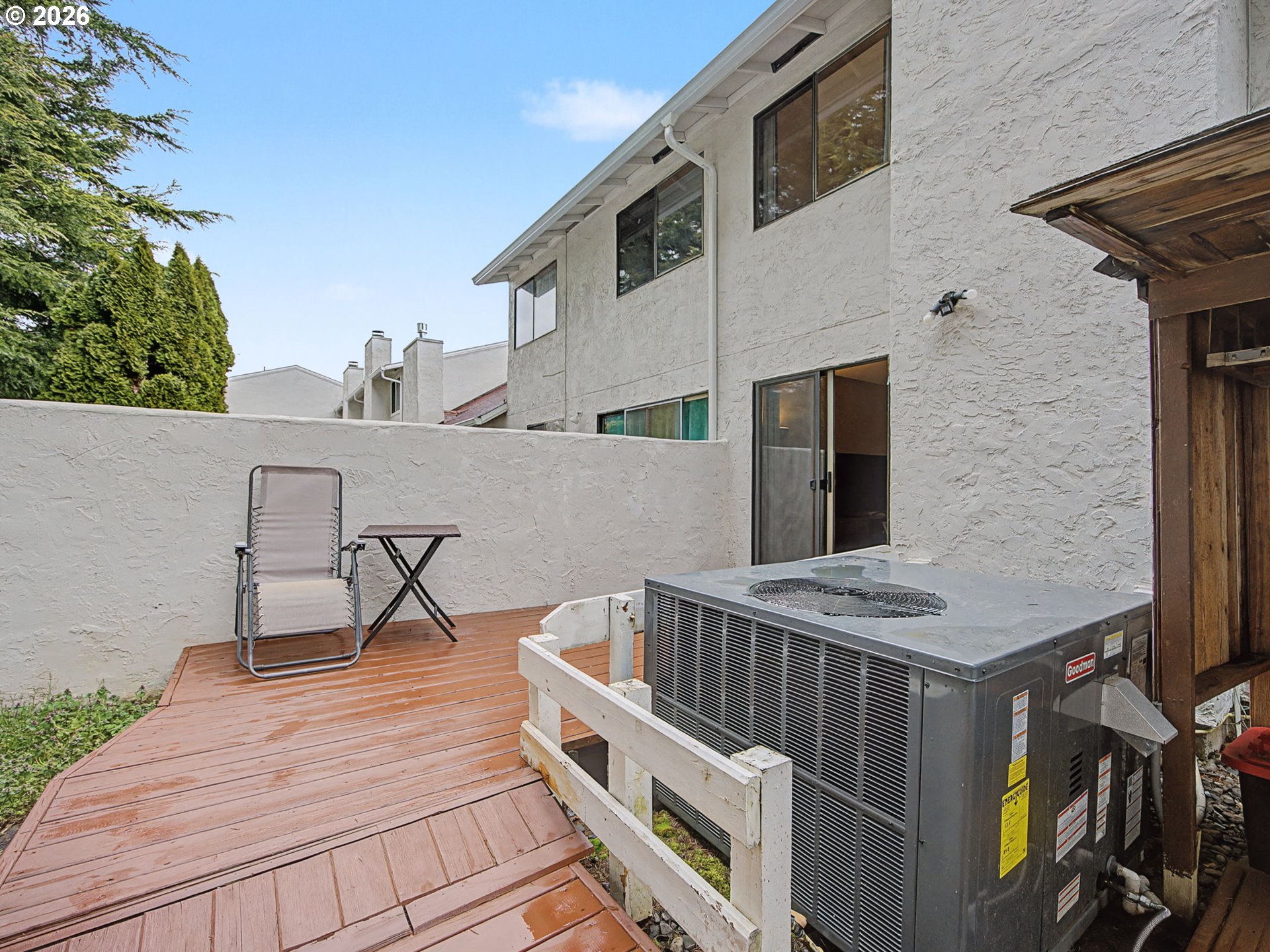 3214 Northeast 29th Street Gresham, OR 97030 - Photo 29 of 42 a roof deck with table and chairs with wooden floor and fence
