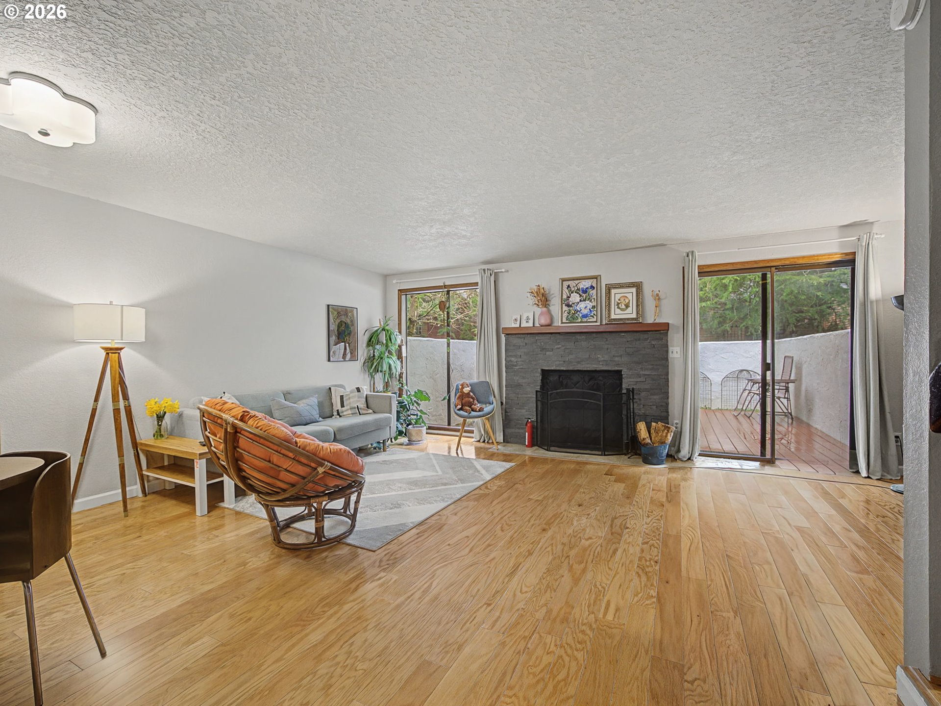 3214 Northeast 29th Street Gresham, OR 97030 - Photo 9 of 42 a living room with furniture and a fireplace