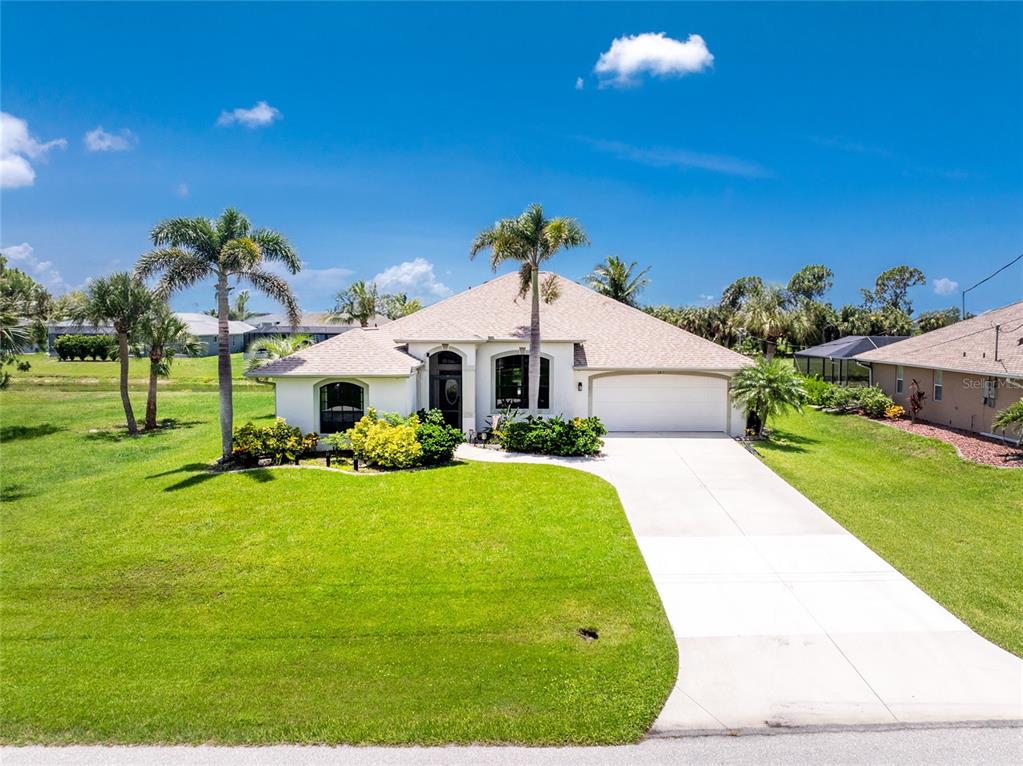 167 Marker Road Rotonda West, FL 33947 - Photo 1 of 1 a front view of a house with a yard