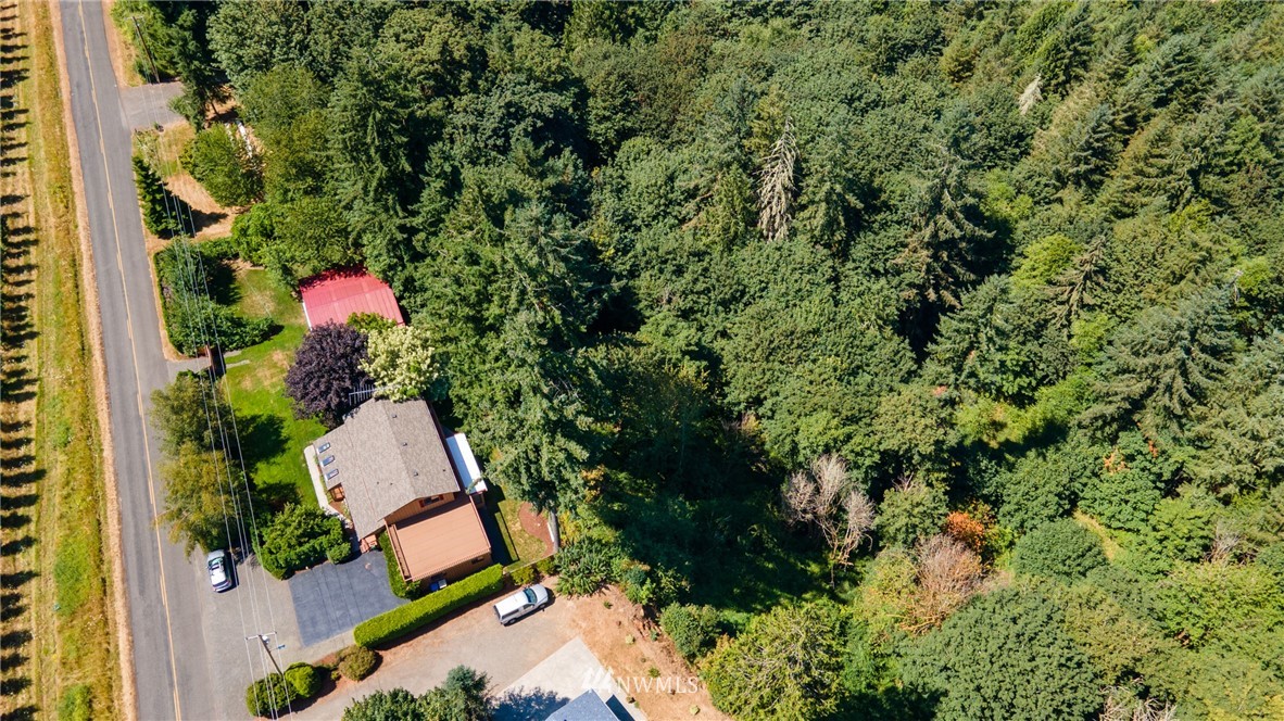 765 Eadon Road Toledo, WA 98591 - Photo 2 of 40 an aerial view of a house with a yard and swimming pool
