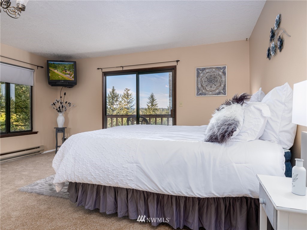 765 Eadon Road Toledo, WA 98591 - Photo 11 of 40 a bedroom with a bed and a dresser