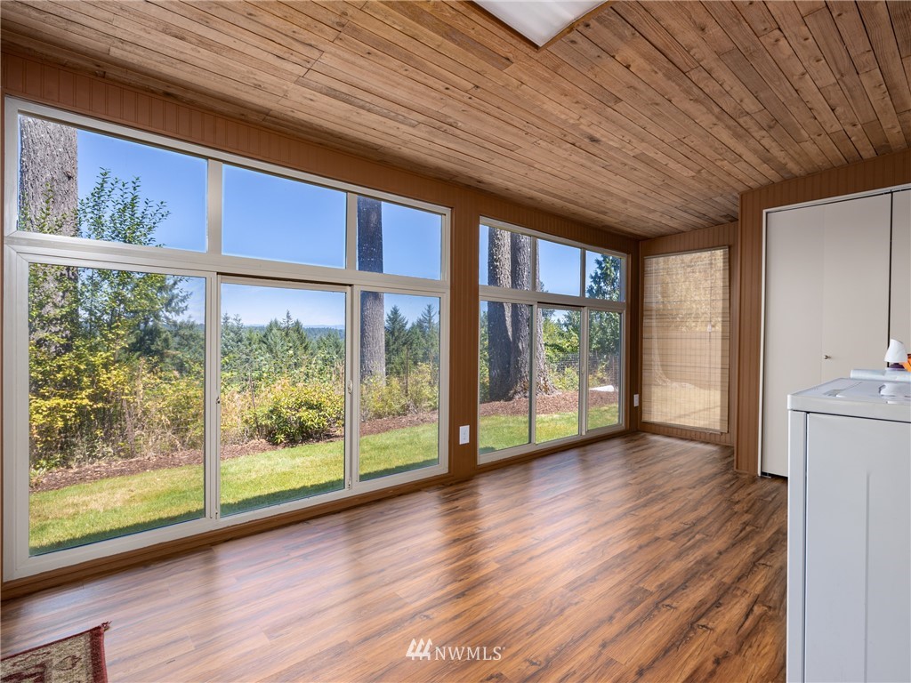 765 Eadon Road Toledo, WA 98591 - Photo 18 of 40 a view of an empty room with wooden floor and a window