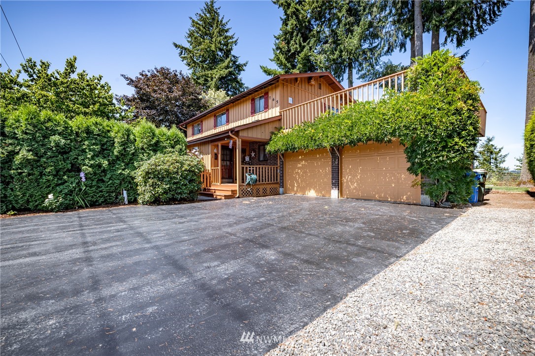 765 Eadon Road Toledo, WA 98591 - Photo 23 of 40 a view of a house with a yard and tree