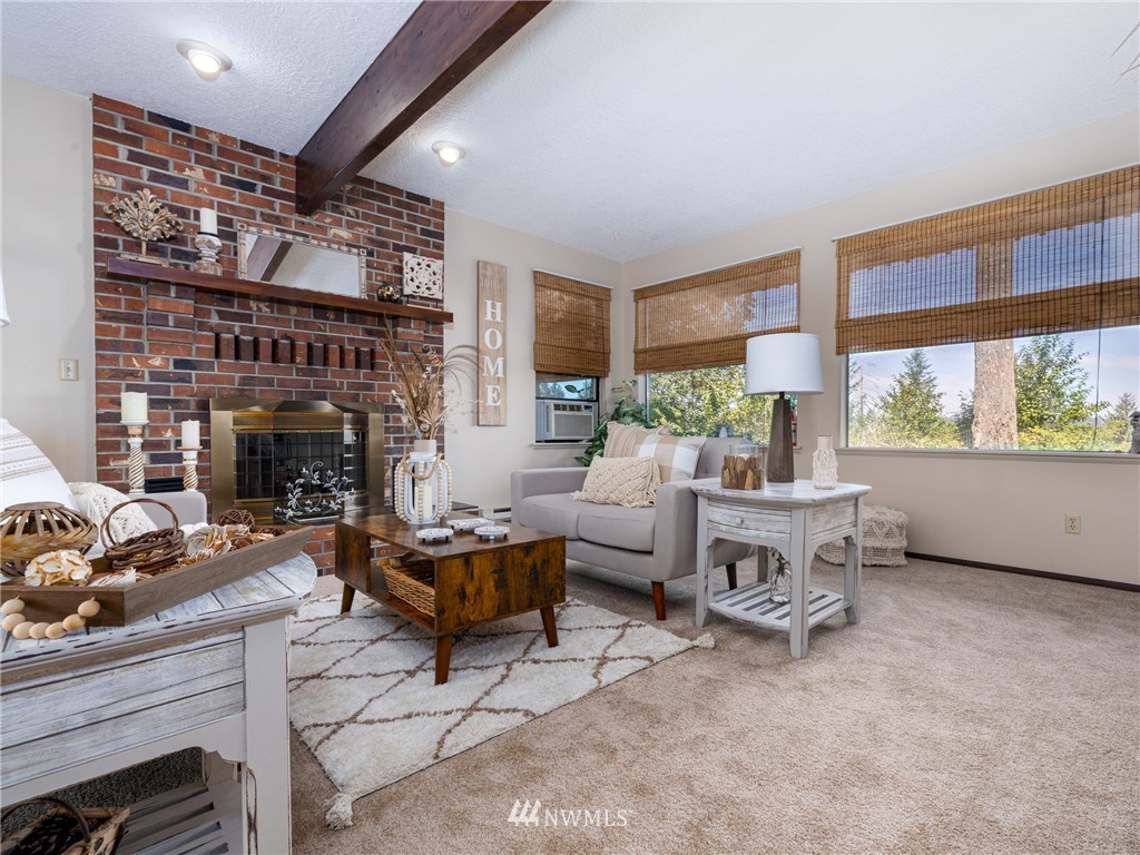 765 Eadon Road Toledo, WA 98591 - Photo 9 of 40 a living room with furniture and a fireplace
