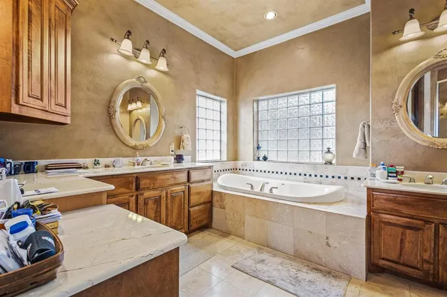 a spacious bathroom with a sink double vanity and a mirror