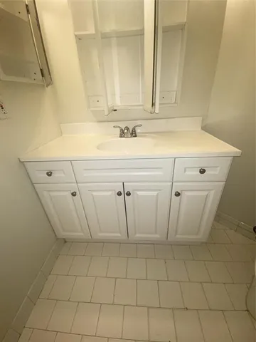 a kitchen with stainless steel appliances a stove a refrigerator and cabinets