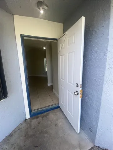 a view of a closet with wooden floor
