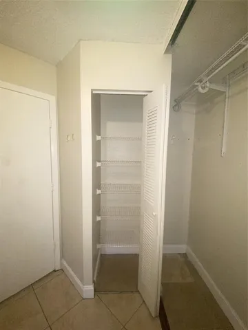 a view of a room with racks on the wall