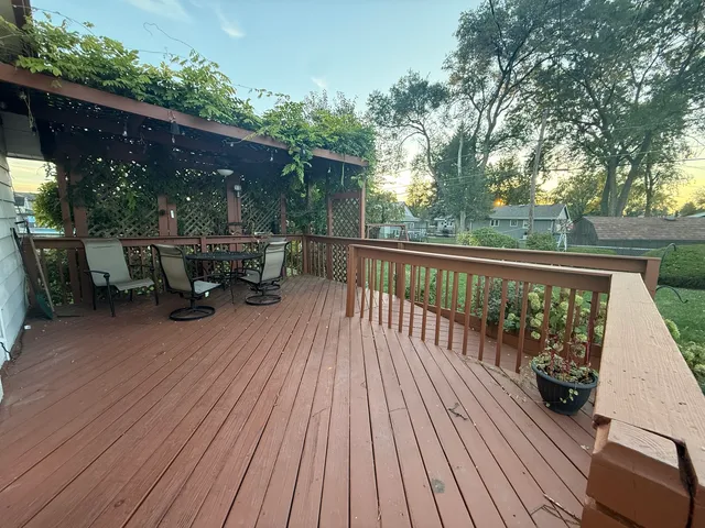 a view of backyard with sitting area