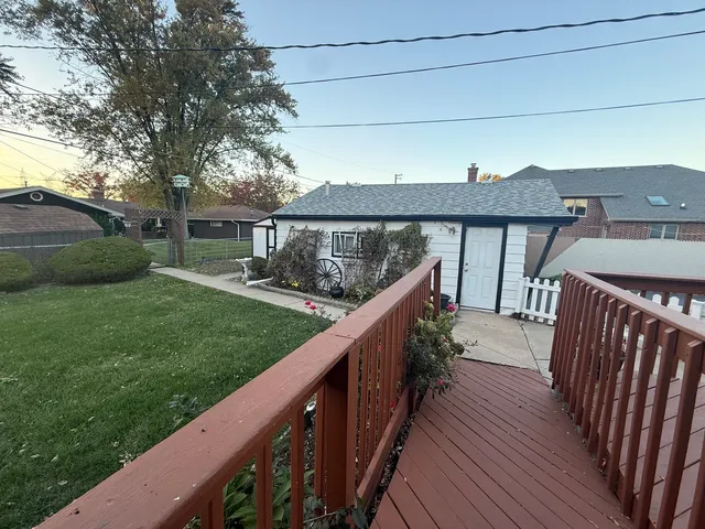 a view of a wooden deck and garden