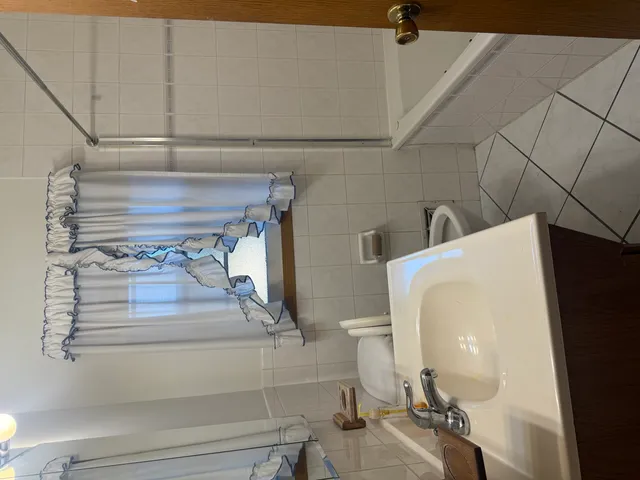 a view of a living room and entryway