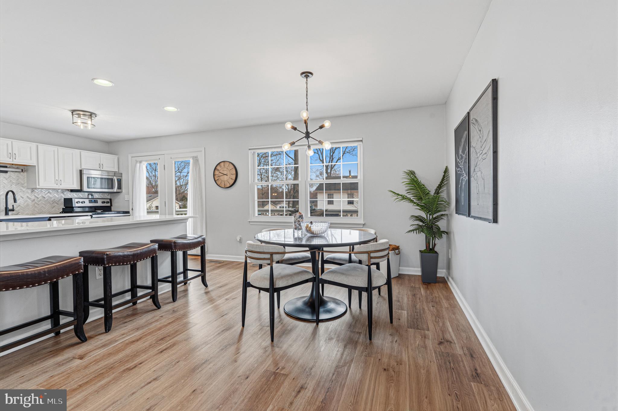 243 9th Street Pasadena, MD 21122 - Photo 11 of 41 a view of a dining room with furniture and wooden floor