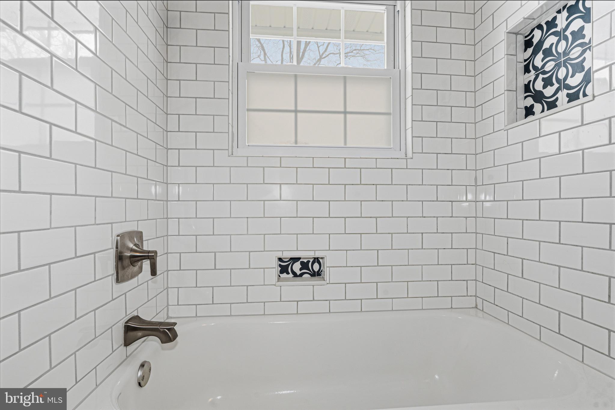 243 9th Street Pasadena, MD 21122 - Photo 23 of 41 a bathroom with a shower