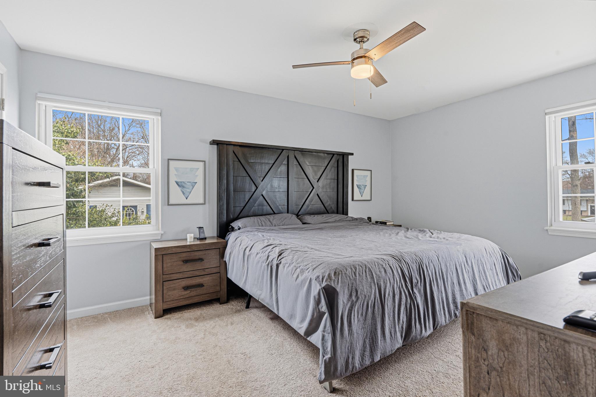243 9th Street Pasadena, MD 21122 - Photo 26 of 41 a bedroom with a bed dresser and a window