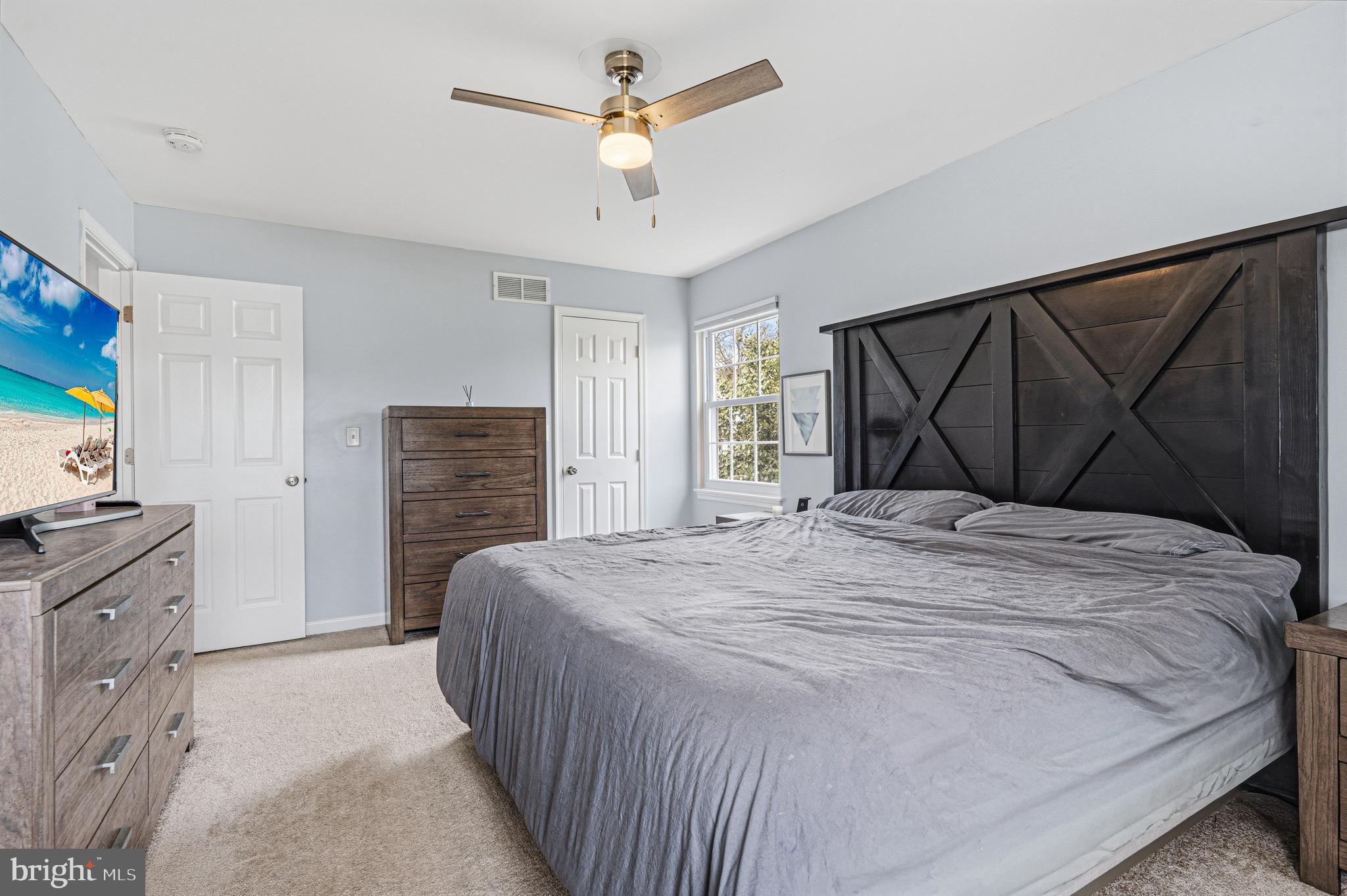 243 9th Street Pasadena, MD 21122 - Photo 27 of 41 a bedroom with a bed dresser and a window