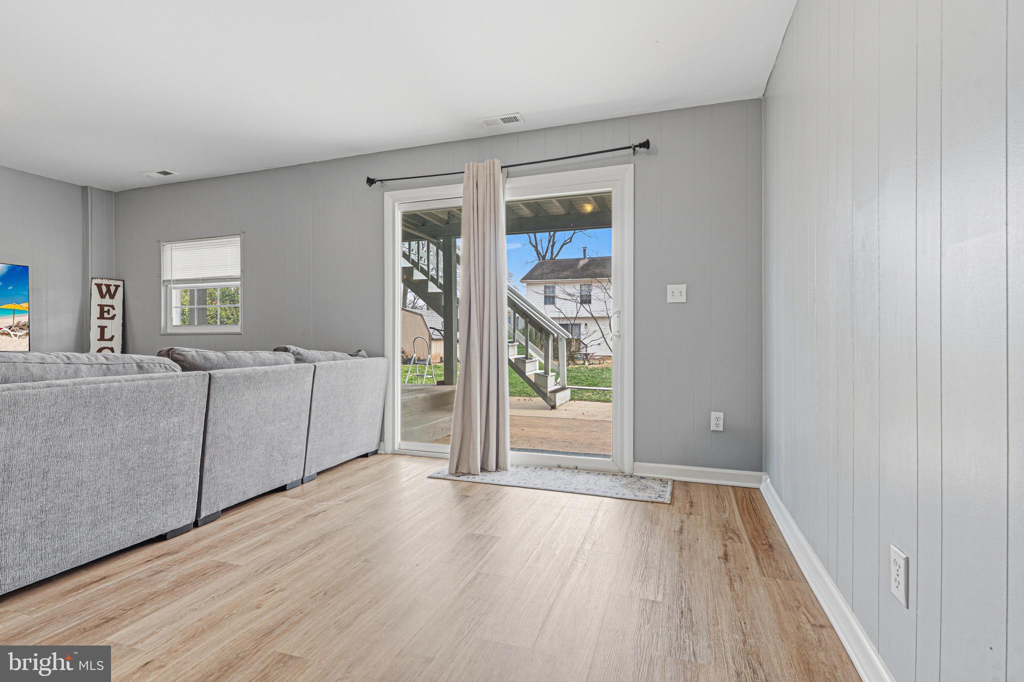 243 9th Street Pasadena, MD 21122 - Photo 31 of 41 wooden floor in an empty room