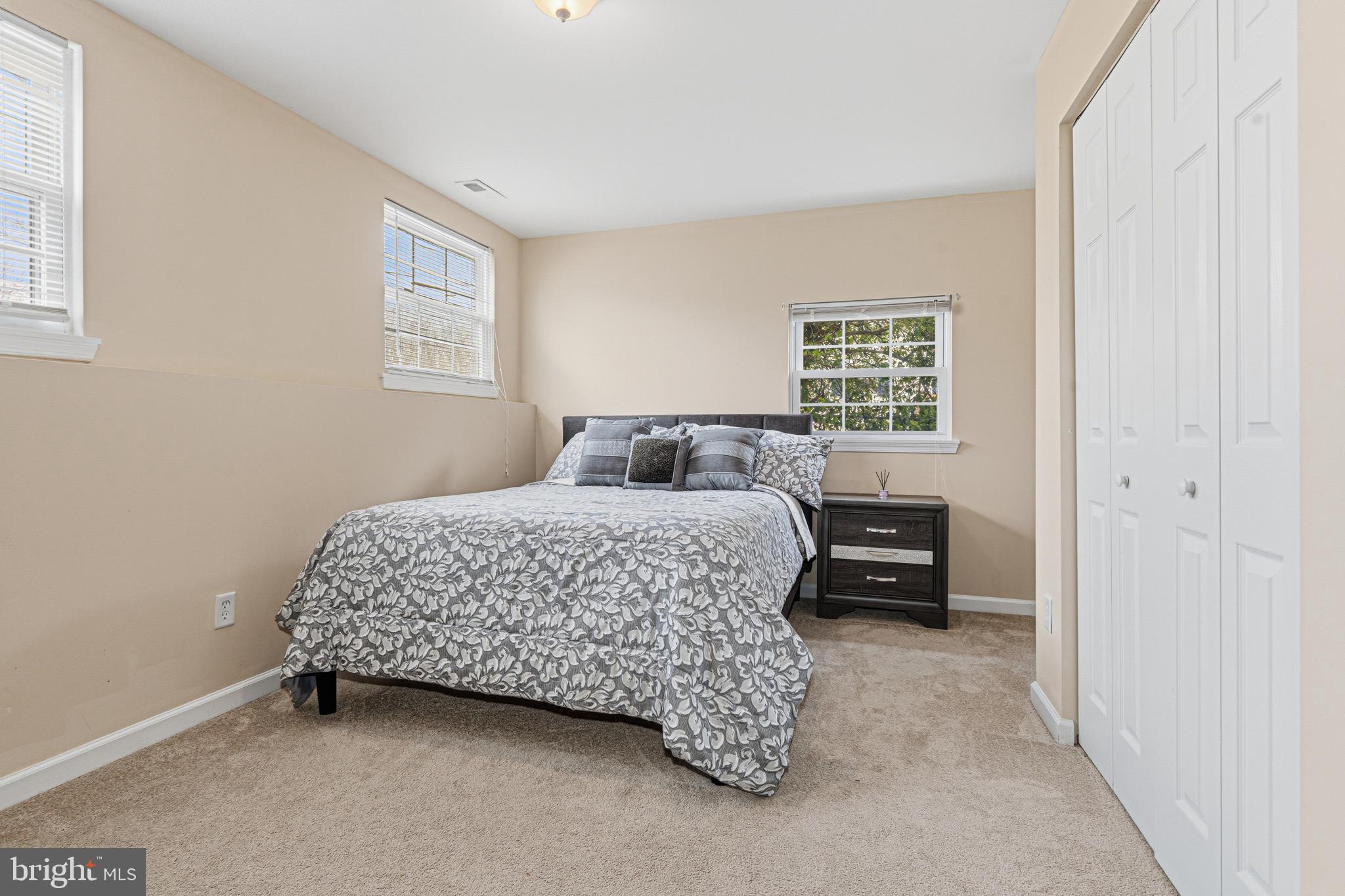 243 9th Street Pasadena, MD 21122 - Photo 32 of 41 a bedroom with a bed and a window