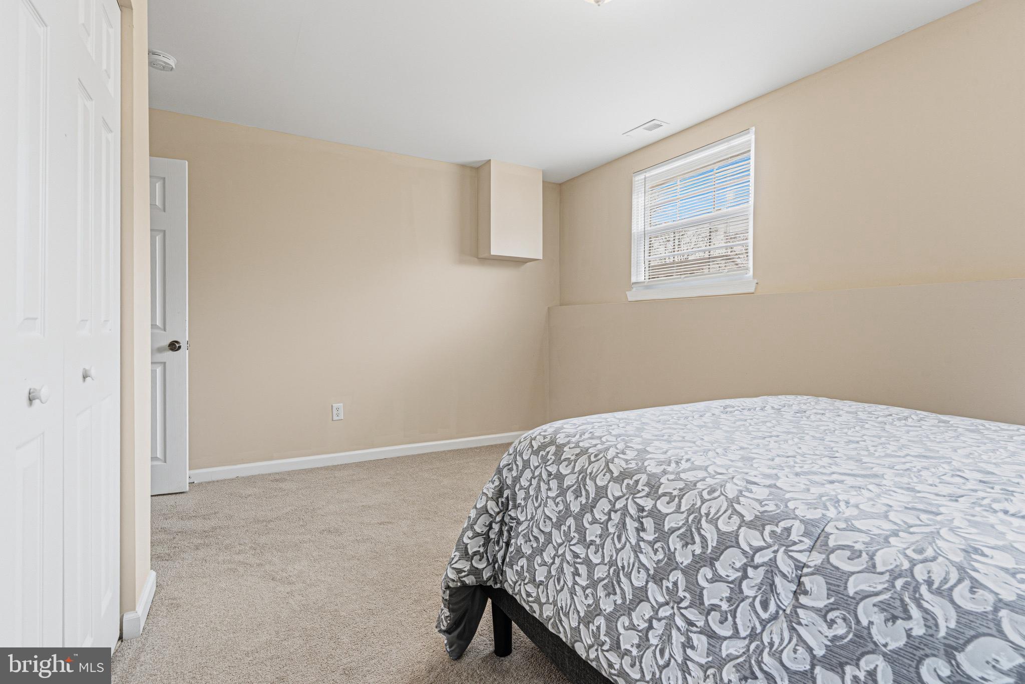 243 9th Street Pasadena, MD 21122 - Photo 33 of 41 a bedroom with a bed and a window