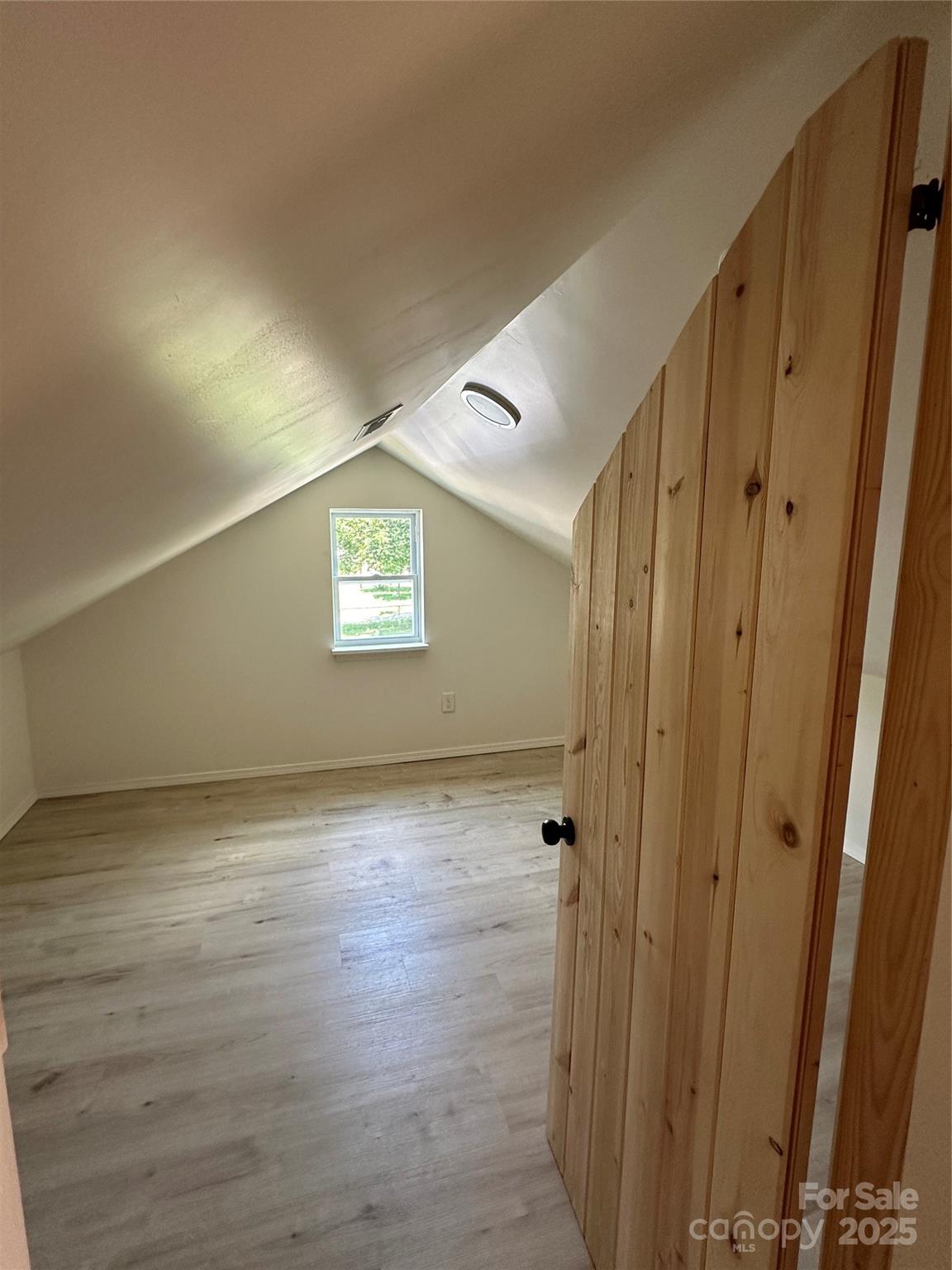1409 Enochville Road Kannapolis, NC 28081 - Photo 14 of 14 a view of an empty room and wooden floor