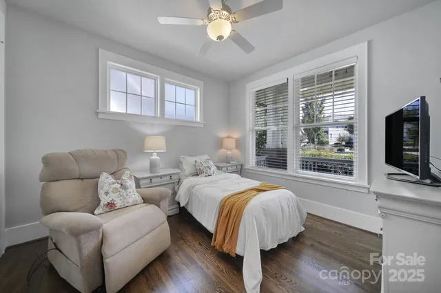 a bed room with bed and a flat screen tv