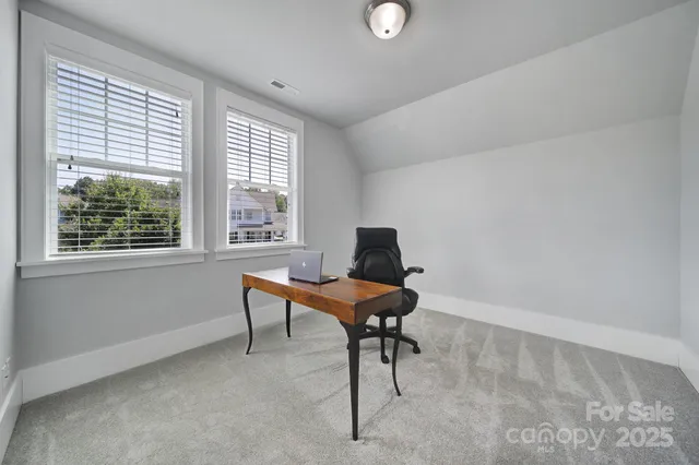 a workspace with furniture and a window