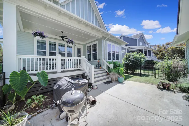a view of a porch with furniture and a grill