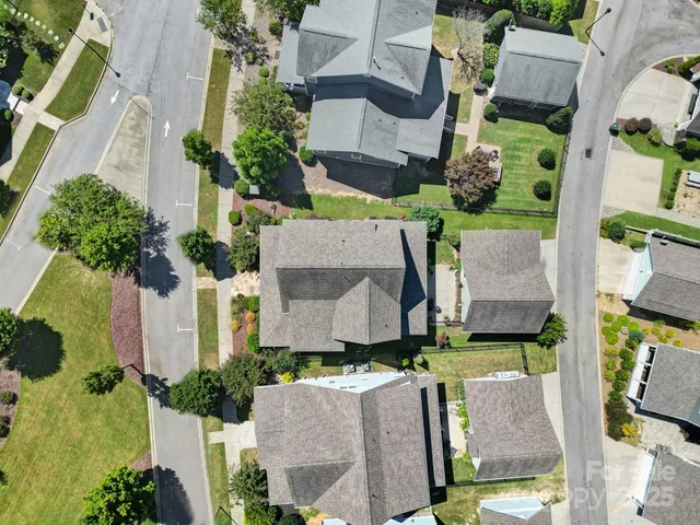 an aerial view of multiple houses with outdoor space