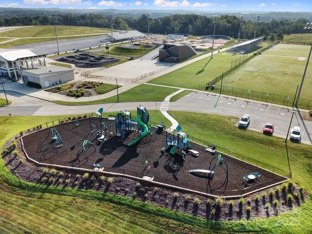 an aerial view of a house with a lake view