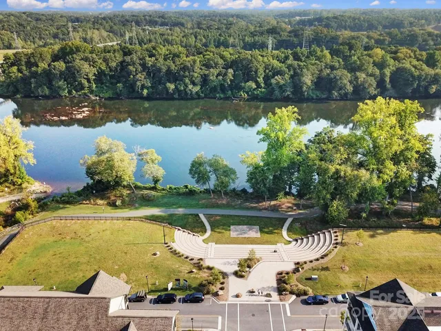 a view of a swimming pool with a yard