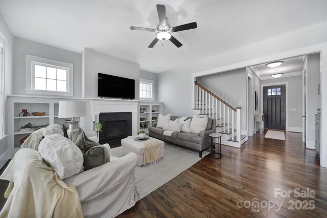 a living room with furniture fireplace and a flat screen tv