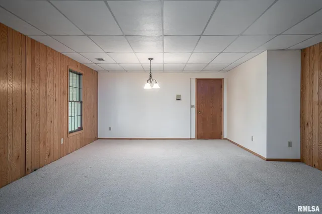 a view of a livingroom with a ceiling fan and window