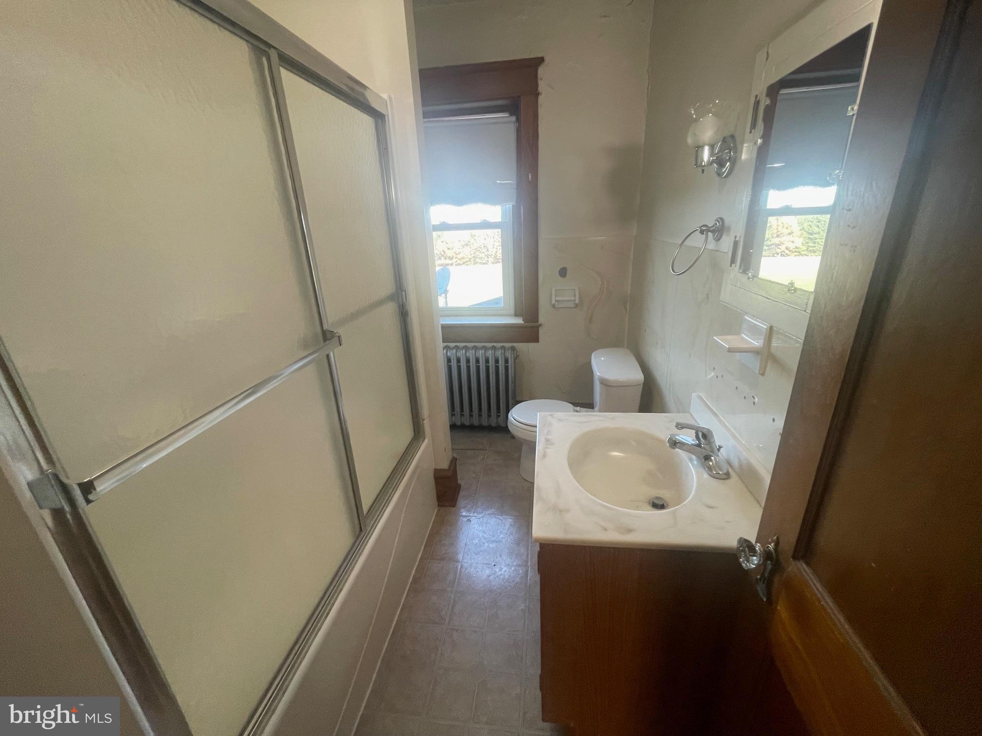 219 Herr Road Ronks, PA 17572 - Photo 16 of 25 a bathroom with a sink a toilet and shower