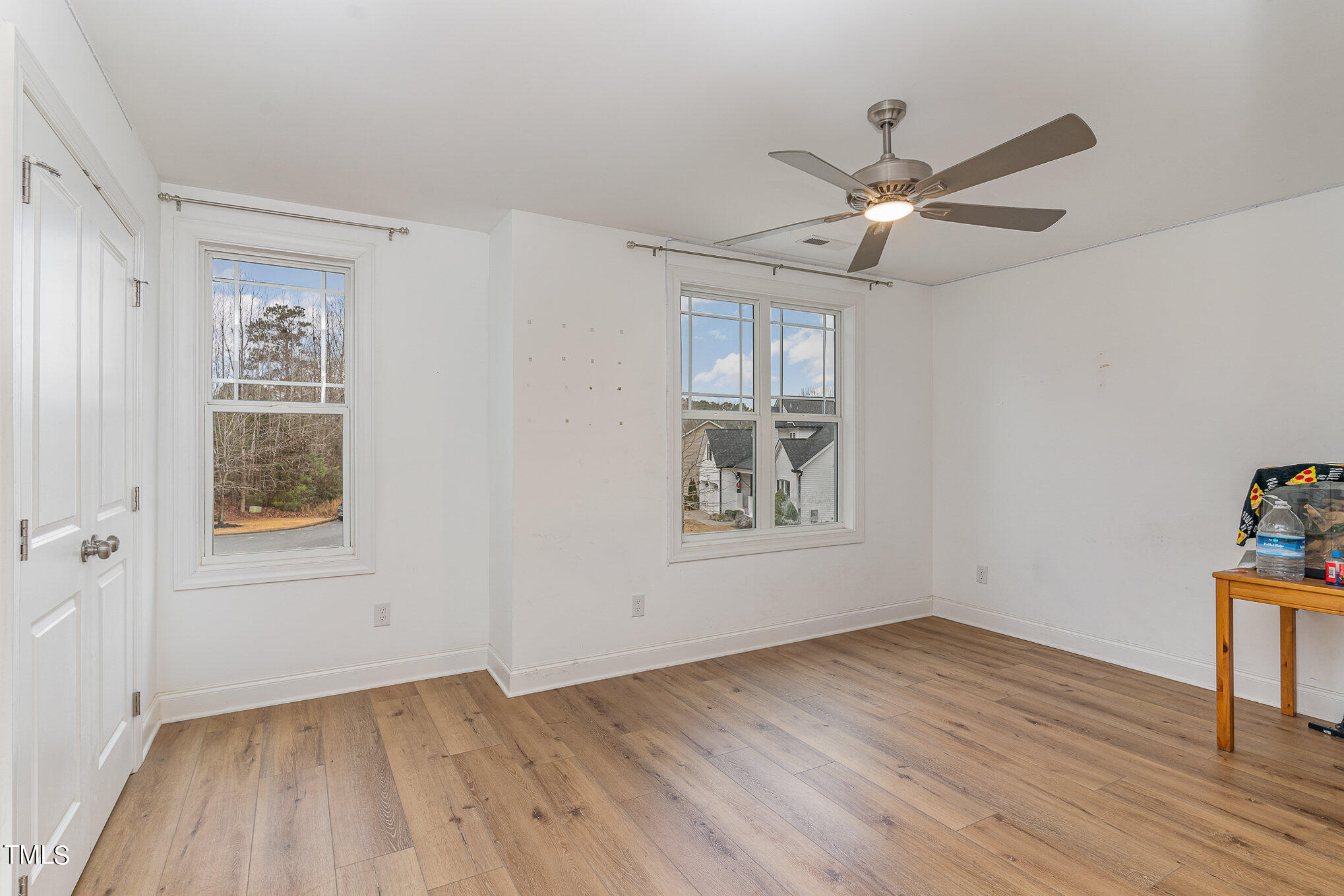125 Holyoke Court Raleigh, NC 27603 - Photo 21 of 30 a view of an empty room with wooden floor and a window