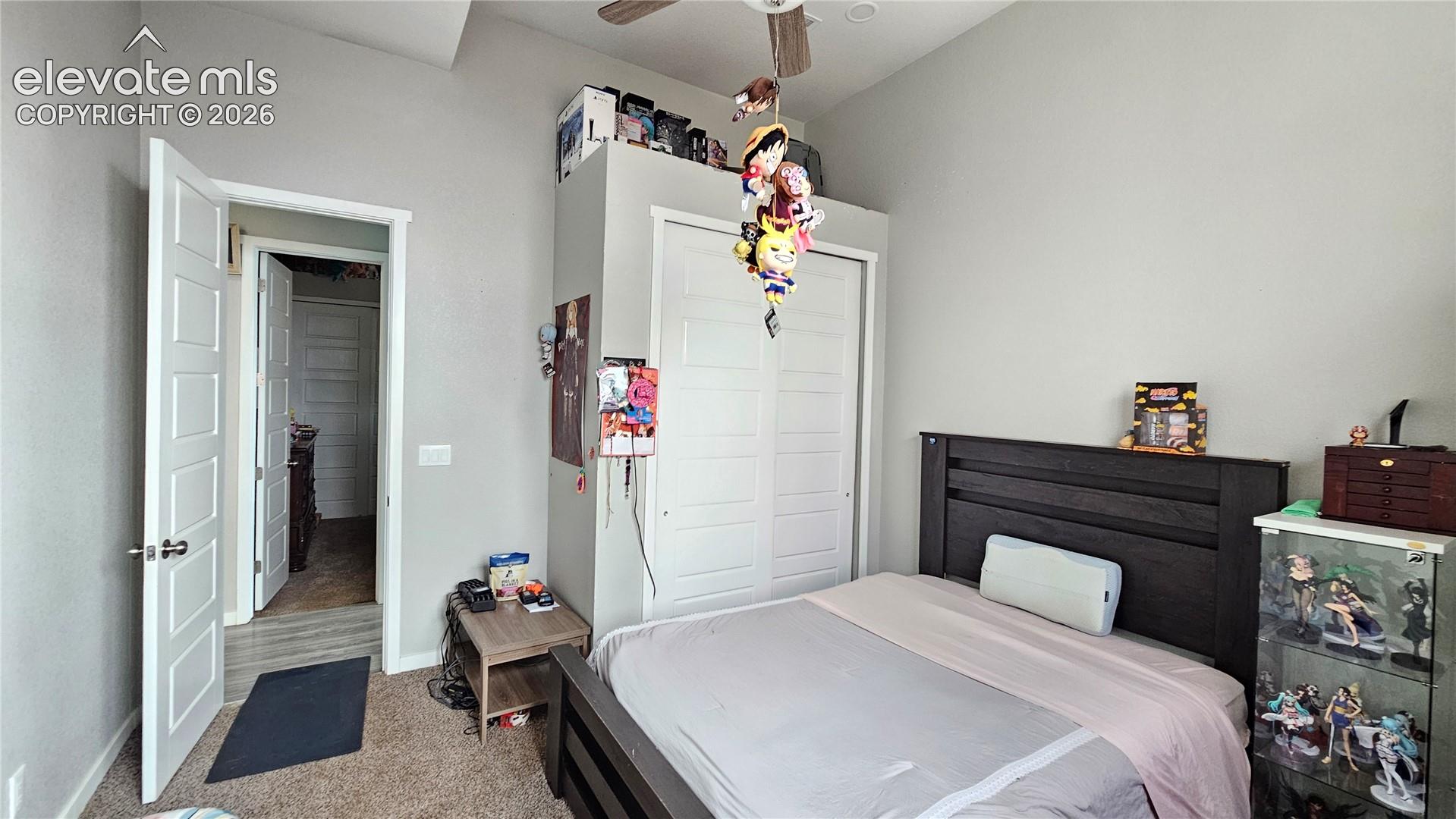 3835 Sengbeil Road Yoder, CO 80864 - Photo 21 of 48 Bedroom featuring a vaulted ceiling and a ceiling fan