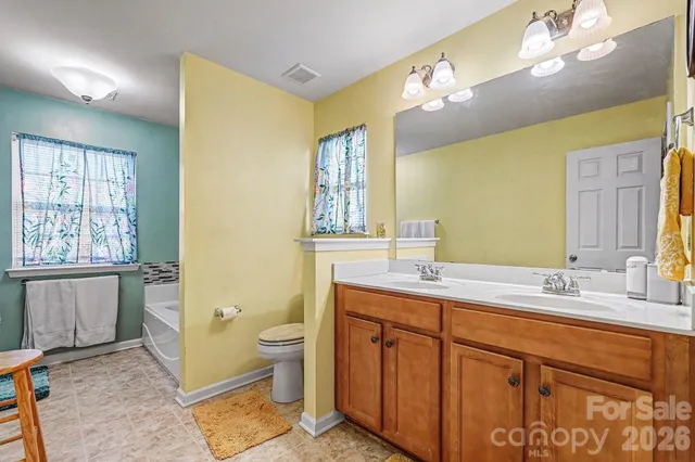 a bathroom with a bathtub and window