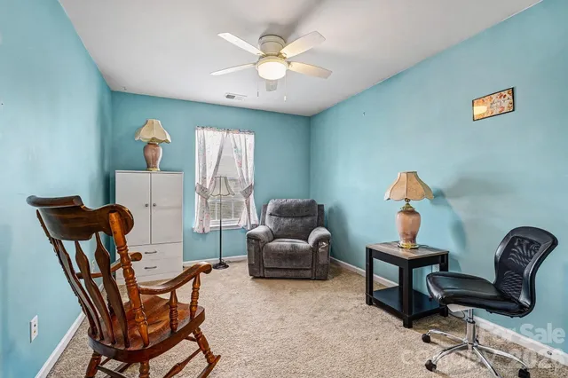 a room with furniture and wooden floor