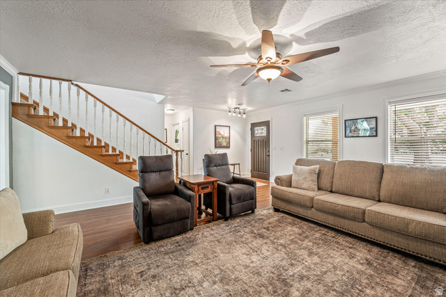 246 West Mount Charm Road Toquerville, UT 84774 - Photo 12 of 70 Living area featuring wood finished floors, a textured ceiling, a ceiling fan, and ornamental molding